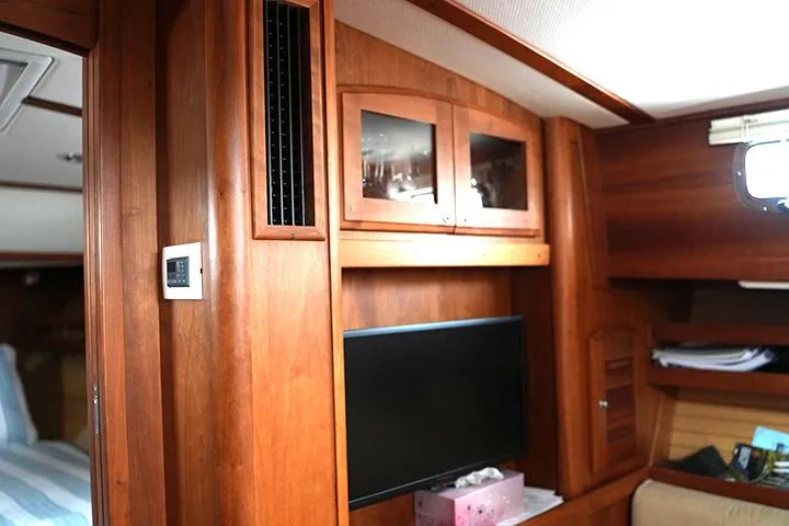Melissa Marie 2 Yacht Photos Pics Interior of 2006 Sabre 38 Hardtop Express with wood paneling and mounted TV.