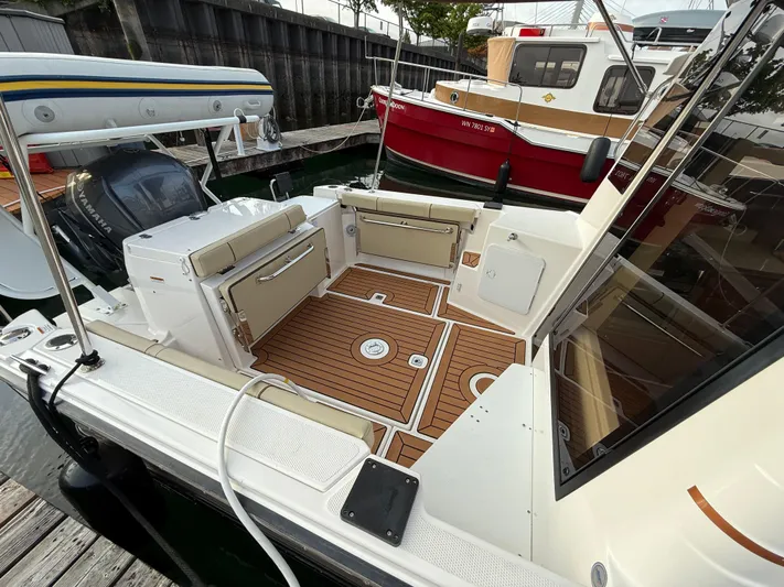  Yacht Photos Pics 2021 Ranger Tugs R-27 boat with teak deck, docked at marina.