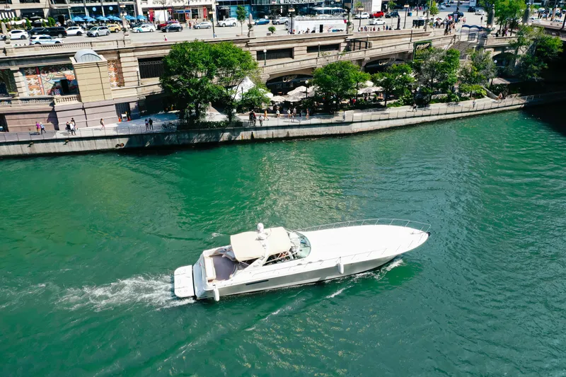  Yacht Photos Pics 1997 Sea Ray 630 Super Sun Sport yacht cruising on a scenic river.