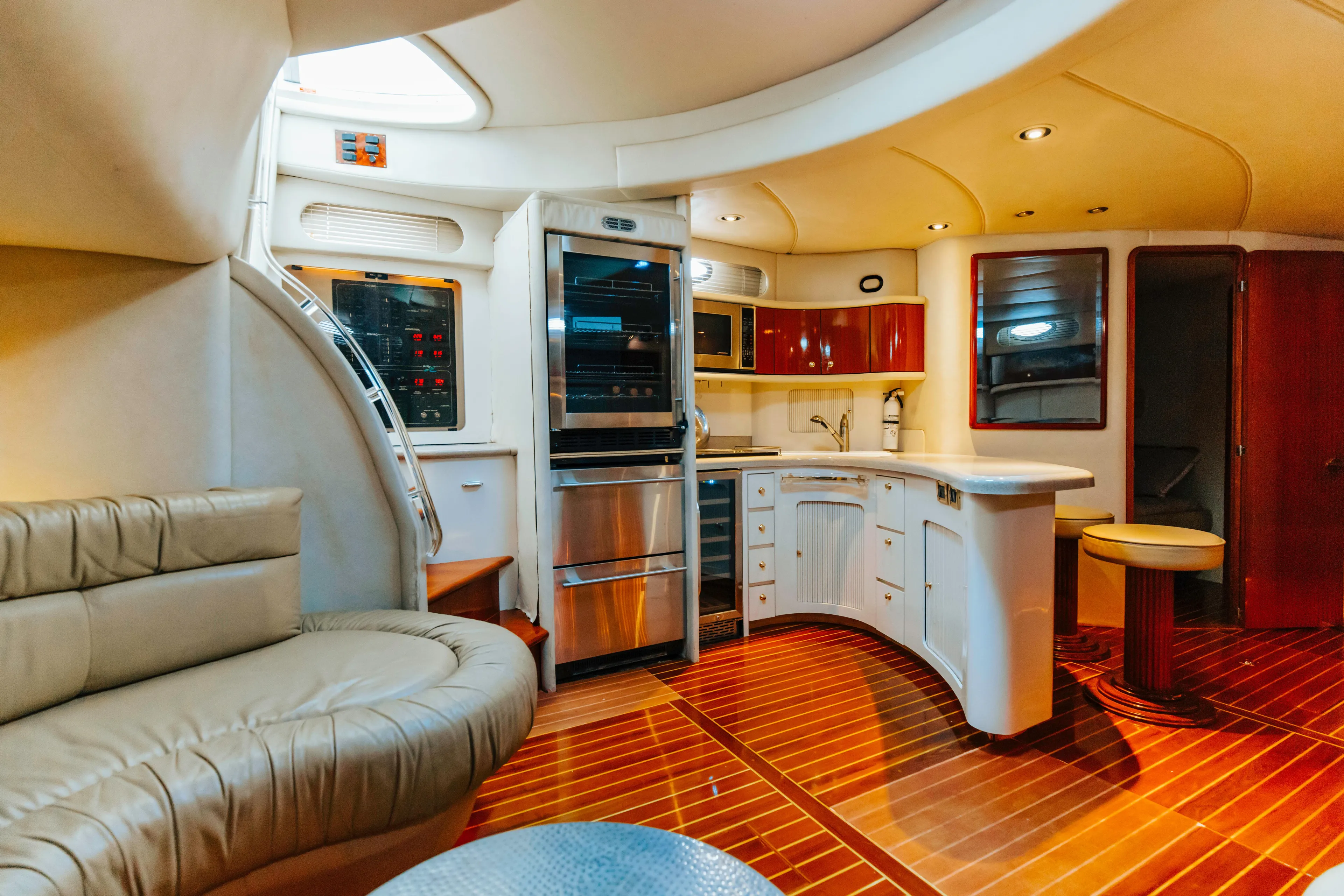  Yacht Photos Pics Luxurious interior of 1997 Sea Ray 630 Super Sun Sport yacht with modern kitchen and seating.