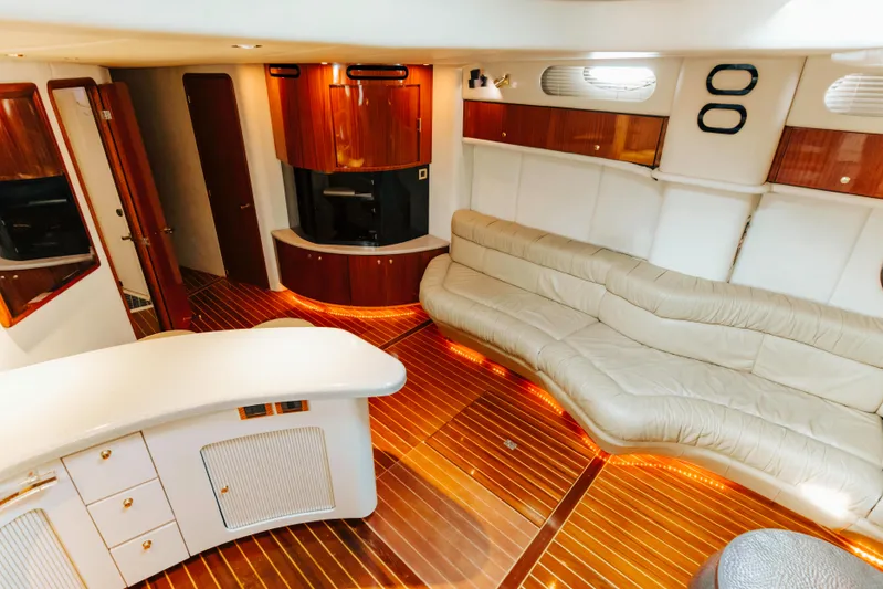  Yacht Photos Pics Luxurious interior of 1997 Sea Ray 630 Super Sun Sport yacht with elegant wood finishes.