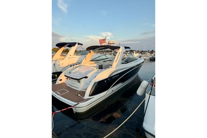  Yacht Photos Pics 2008 Formula 350 Sun Sport boat docked at marina during sunset.