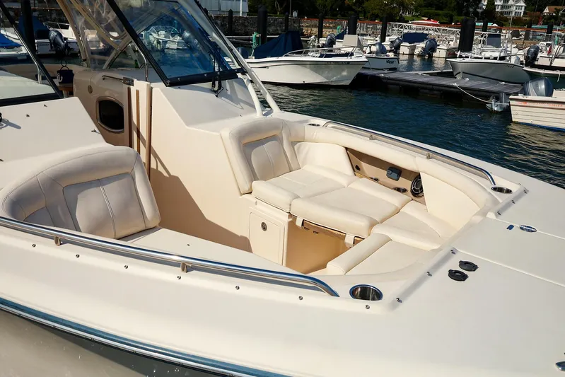 4850 Jg Yacht Photos Pics 2015 Grady White 335 Freedom boat interior with plush seating at marina.