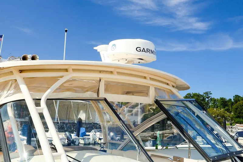4850 Jg Yacht Photos Pics 2015 Grady White 335 Freedom boat with Garmin radar, docked under clear blue sky.