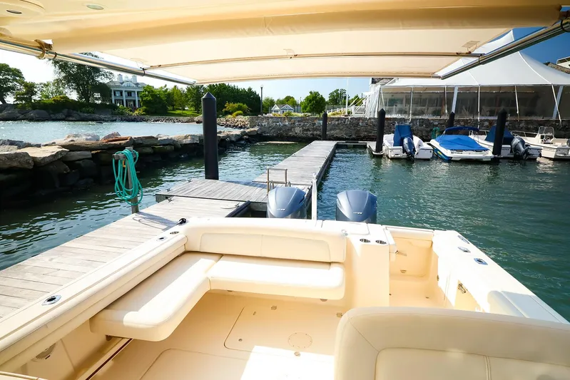 4850 Jg Yacht Photos Pics 2015 Grady White 335 Freedom boat docked at a marina with scenic waterfront view.