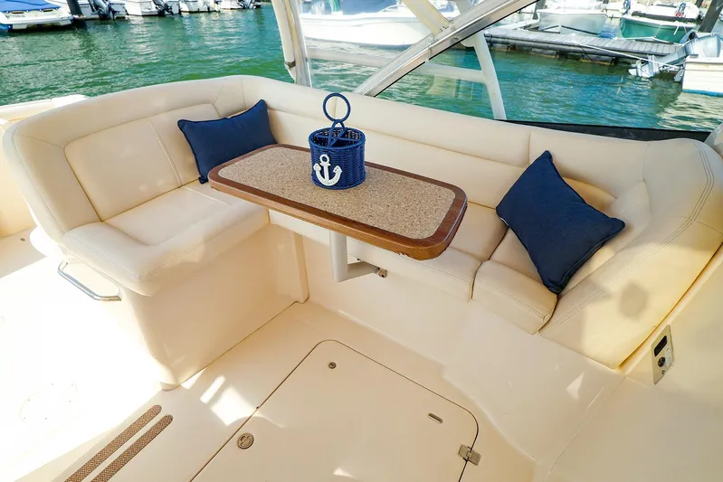 4850 Jg Yacht Photos Pics Luxurious seating area on a 2015 Grady White 335 Freedom boat with nautical decor.