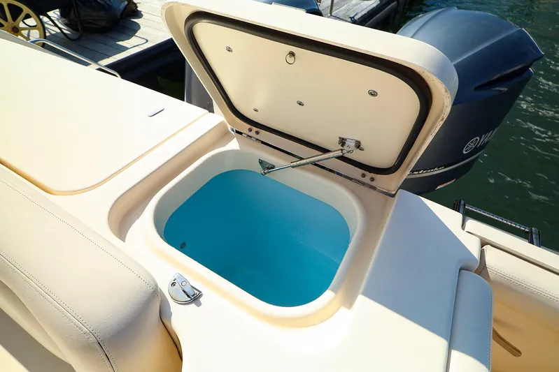 4850 Jg Yacht Photos Pics Open storage compartment on 2015 Grady White 335 Freedom boat, near Yamaha outboard motor.