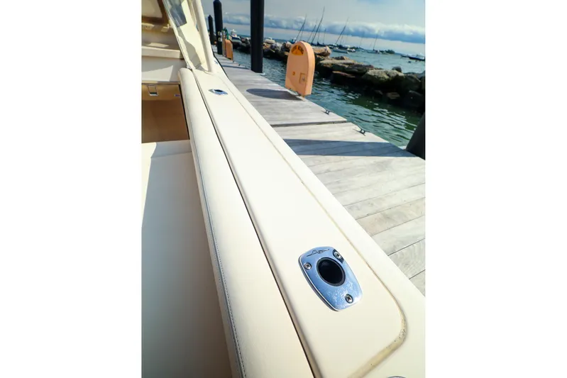 4850 Jg Yacht Photos Pics 2015 Grady White 335 Freedom boat docked by the water.