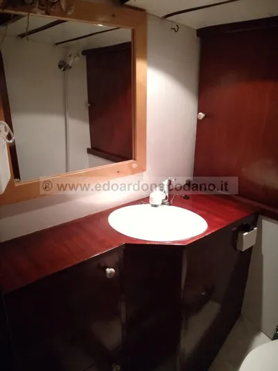  Yacht Photos Pics Classic 1984 Sciarrelli yacht bathroom with wooden cabinetry and sink.