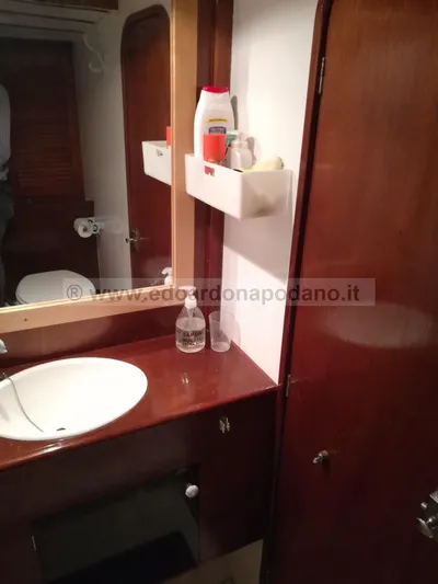  Yacht Photos Pics Classic 1984 Sciarrelli yacht bathroom with wooden cabinetry and sink.