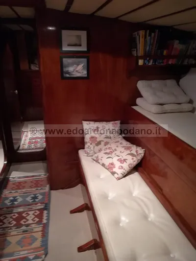  Yacht Photos Pics Cozy 1984 Classic Sciarrelli yacht interior with wooden paneling and cushioned seating.