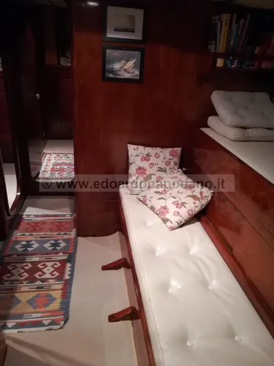  Yacht Photos Pics Cozy 1984 Classic Sciarrelli yacht interior with wooden paneling and floral cushions.