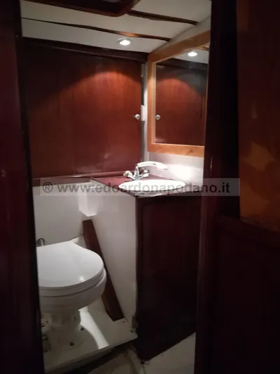  Yacht Photos Pics 1984 Classic Sciarrelli yacht bathroom with wooden interior and compact design.