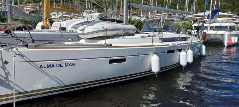 Alma Del Mar Yacht Photos Pics 2014 Jeanneau Sun Odyssey 469 sailboat docked in marina, named "Alma de Mar".