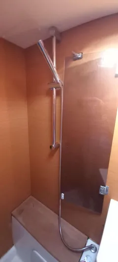 Alma Del Mar Yacht Photos Pics Shower area in 2014 Jeanneau Sun Odyssey 469 yacht with glass partition.