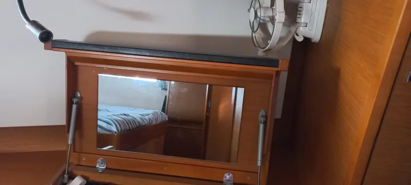 Alma Del Mar Yacht Photos Pics 2014 Jeanneau Sun Odyssey 469 cabin interior with mirror and fan.