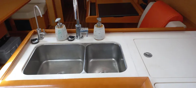 Alma Del Mar Yacht Photos Pics 2014 Jeanneau Sun Odyssey 469 kitchen sink with dual basins and soap dispensers.