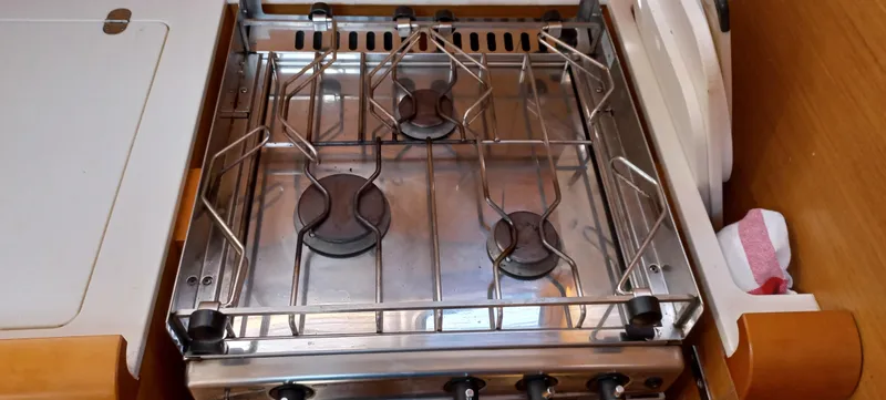 Alma Del Mar Yacht Photos Pics Stainless steel stove in 2014 Jeanneau Sun Odyssey 469 yacht kitchen.