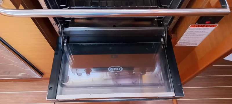 Alma Del Mar Yacht Photos Pics Open oven door inside 2014 Jeanneau Sun Odyssey 469 yacht kitchen.