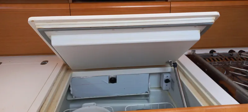 Alma Del Mar Yacht Photos Pics Open refrigerator in 2014 Jeanneau Sun Odyssey 469 yacht kitchen.