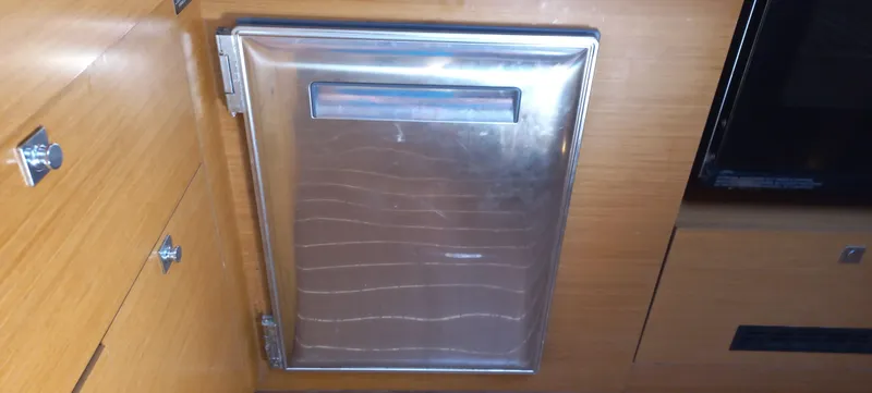 Alma Del Mar Yacht Photos Pics Stainless steel refrigerator door inside 2014 Jeanneau Sun Odyssey 469 yacht interior.