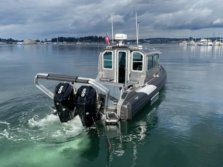  Yacht Photos Pics 2021 Life Proof 25 Full Cabin boat with dual engines on calm water.