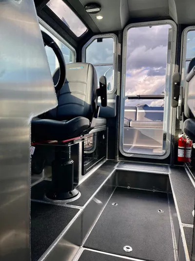  Yacht Photos Pics 2021 Life Proof 25 Full Cabin interior with modern seating and panoramic windows.