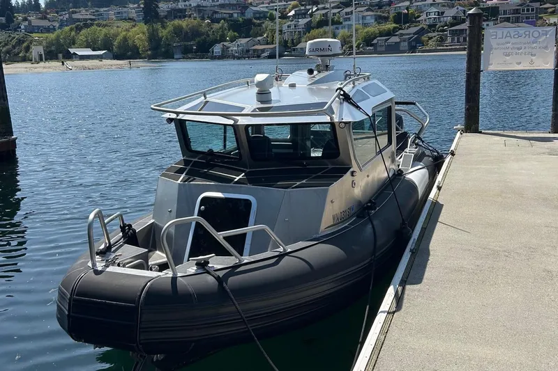  Yacht Photos Pics 2021 Life Proof 25 Full Cabin boat docked at a marina.