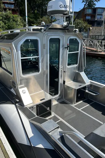  Yacht Photos Pics 2021 Life Proof 25 Full Cabin boat docked, featuring sleek design and modern equipment.