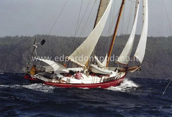  Yacht Photos Pics Classic 1984 Sciarrelli sailboat navigating rough seas with full sails.