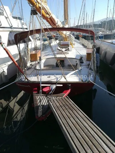  Yacht Photos Pics 1984 Classic Sciarrelli sailboat docked in marina, featuring wooden deck and mast.