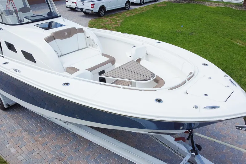  Yacht Photos Pics 2018 Edgewater 370 CC boat on trailer, featuring spacious seating and sleek design.