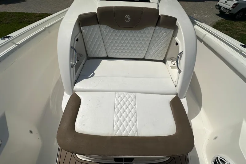  Yacht Photos Pics 2018 Edgewater 370 CC boat with cushioned seating and quilted upholstery.