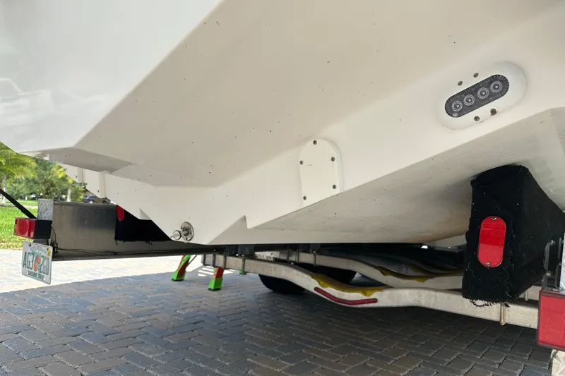  Yacht Photos Pics 2018 Edgewater 370 CC boat on trailer, showing hull and rear light details.