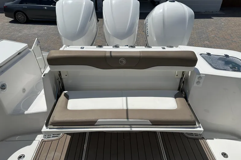  Yacht Photos Pics 2018 Edgewater 370 CC boat with foldable seating and triple outboard engines.