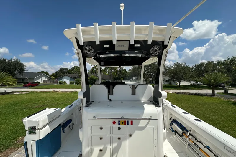  Yacht Photos Pics 2018 Edgewater 370 CC boat interior with fishing rod holders and storage compartments.