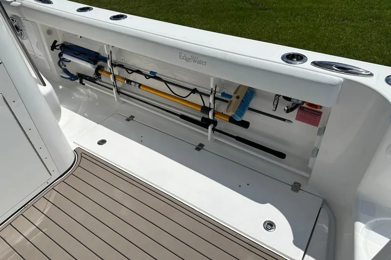  Yacht Photos Pics 2018 Edgewater 370 CC boat storage compartment with fishing gear and equipment.