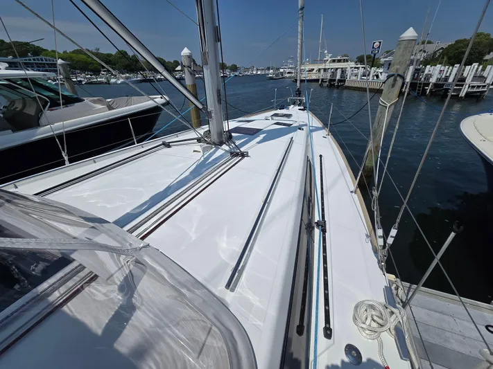 Sabrina Yacht Photos Pics 2013 Beneteau Oceanis 41 sailboat docked at marina, showcasing sleek deck design.