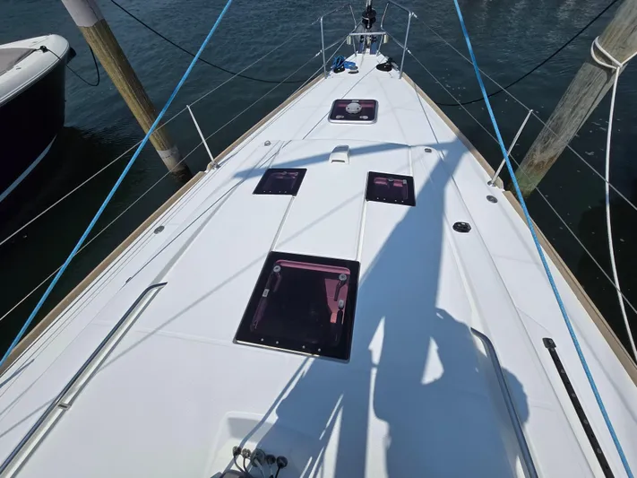 Sabrina Yacht Photos Pics Deck view of a 2013 Beneteau Oceanis 41 sailboat, featuring hatches and rigging.