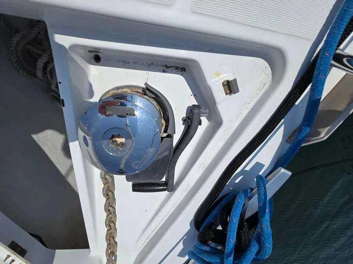 Sabrina Yacht Photos Pics Anchor windlass on 2013 Beneteau Oceanis 41 sailboat deck with blue rope.