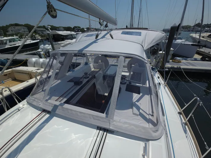 Sabrina Yacht Photos Pics 2013 Beneteau Oceanis 41 sailboat with covered cockpit, docked at marina.