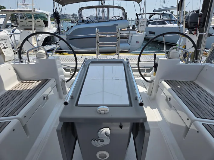 Sabrina Yacht Photos Pics 2013 Beneteau Oceanis 41 sailboat cockpit with dual steering wheels and modern design.