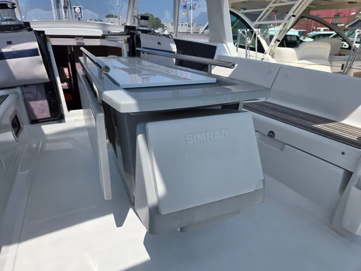 Sabrina Yacht Photos Pics Beneteau Oceanis 41 cockpit with sleek table, modern design, and comfortable seating, 2013 model.