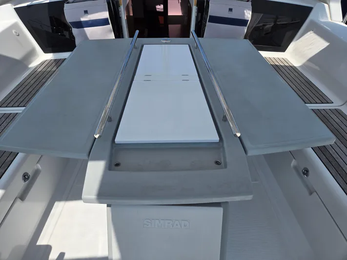 Sabrina Yacht Photos Pics Cockpit of 2013 Beneteau Oceanis 41 sailboat with foldable table and seating.