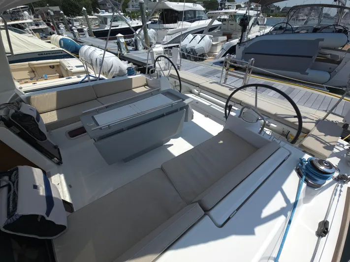 Sabrina Yacht Photos Pics 2013 Beneteau Oceanis 41 sailboat cockpit with seating and steering wheel at marina.