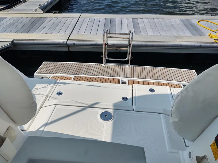 Sabrina Yacht Photos Pics Beneteau Oceanis 41 yacht stern view with swim platform and dock ladder, 2013 model.