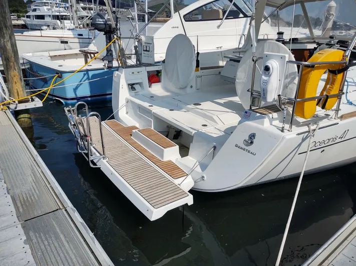 Sabrina Yacht Photos Pics Beneteau Oceanis 41 sailboat, 2013 model, docked with open swim platform.