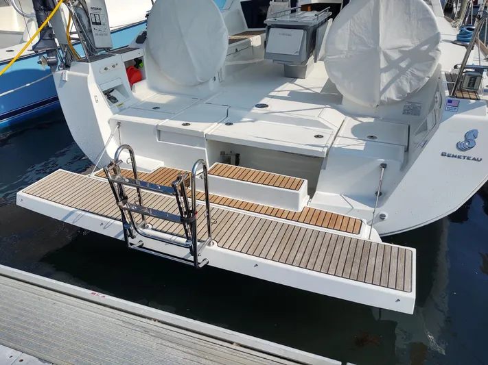 Sabrina Yacht Photos Pics Stern view of 2013 Beneteau Oceanis 41 yacht with teak swim platform and ladder.