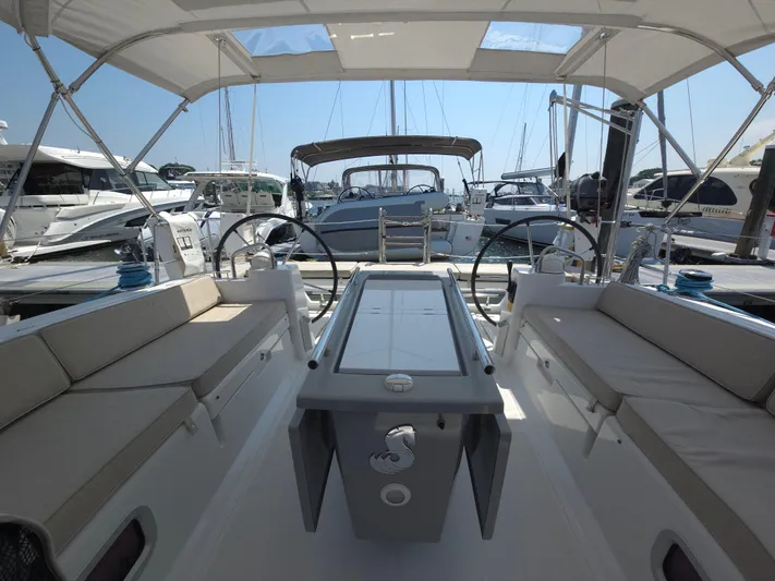 Sabrina Yacht Photos Pics 2013 Beneteau Oceanis 41 yacht interior with dual steering wheels and spacious seating.