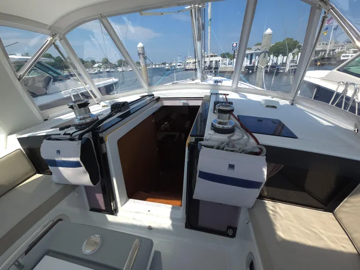 Sabrina Yacht Photos Pics 2013 Beneteau Oceanis 41 cockpit with winches, open hatch, and marina view.